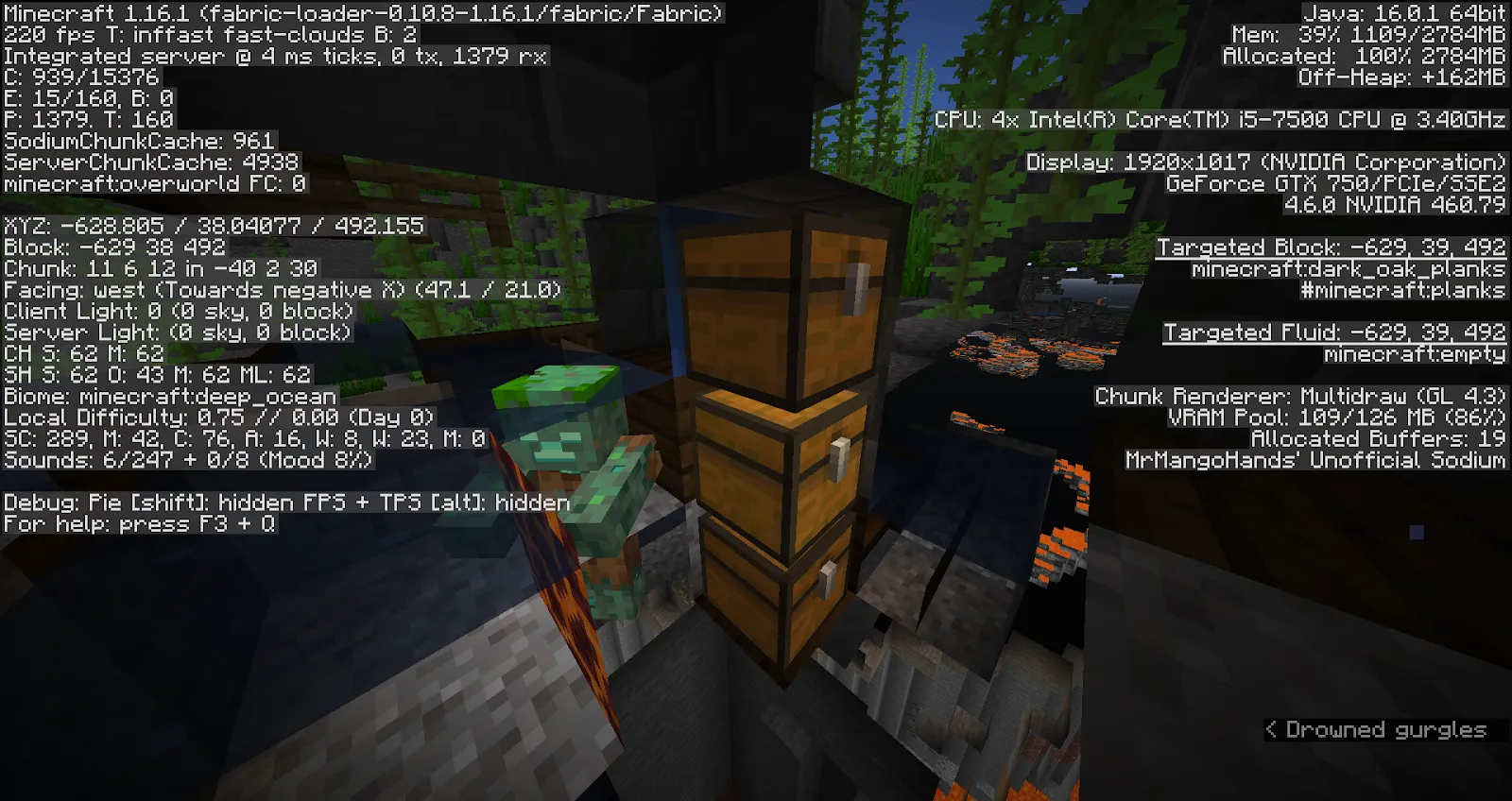 Image of three chests in an underwater ruin in Minecraft. A drowned zombie walks in the background