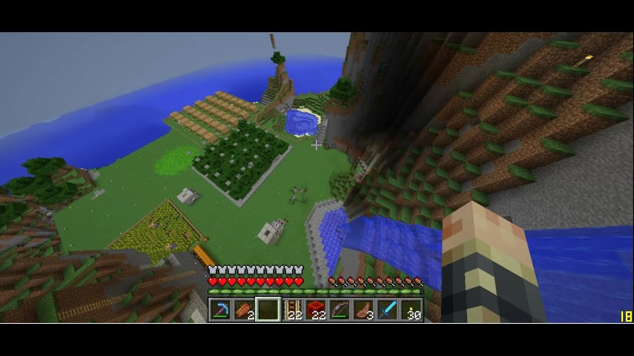 An image of a player looking over a tall mountain in minecraft