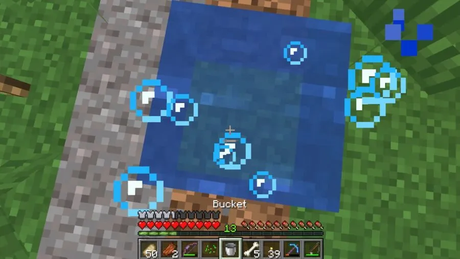 An image of a player emptying a water bucket in Minecraft