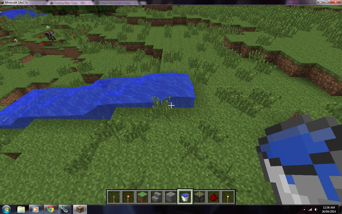 An image of a player using a water bucket in Minecraft