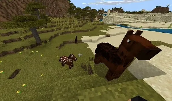 Image of two horses climbing a mountain in Minecraft