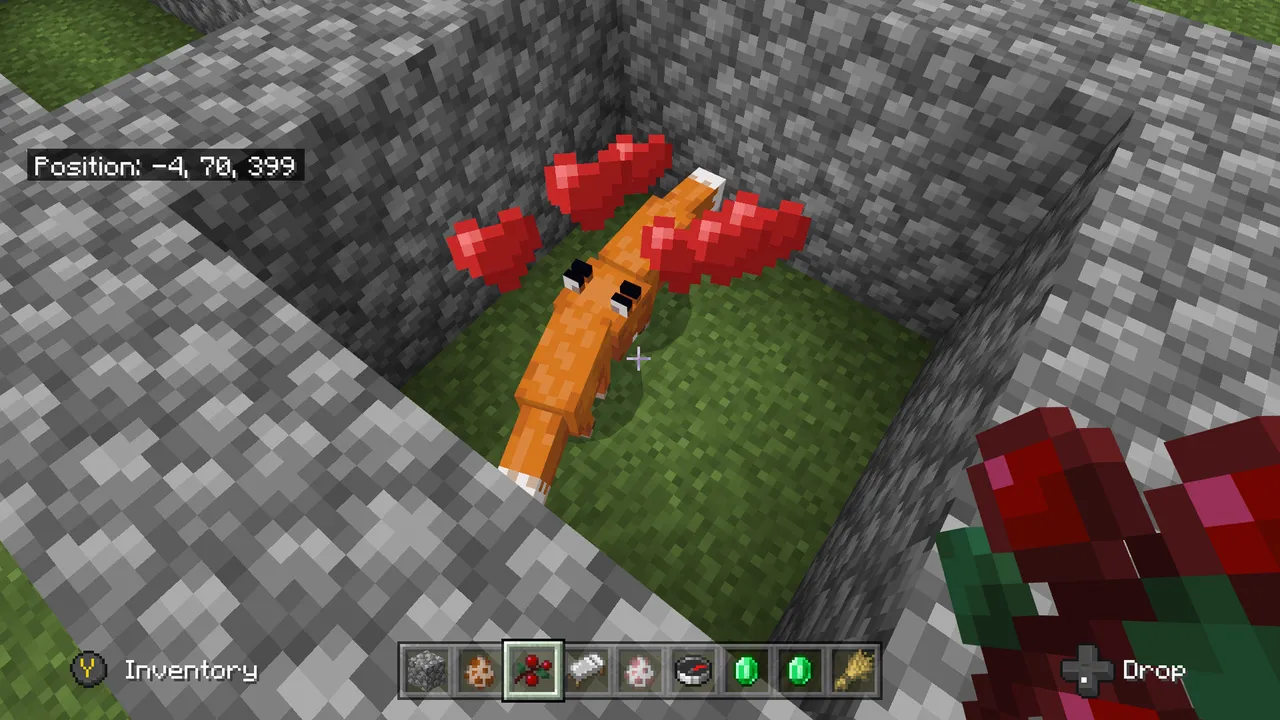 An image of two foxes breeding in a pen in Minecraft
