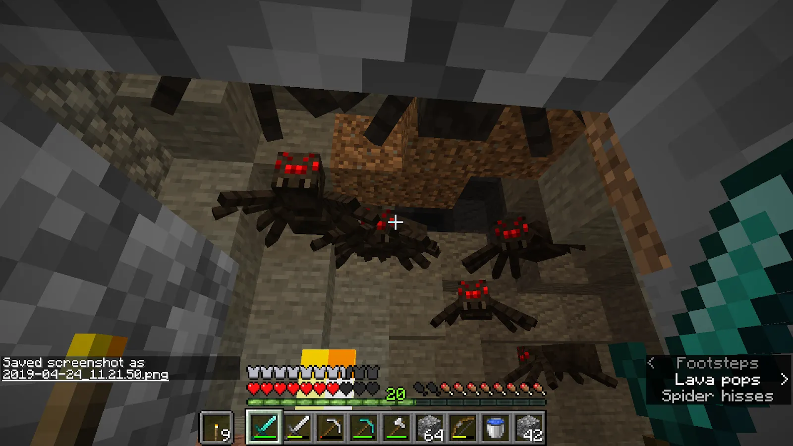 An image of 5 spiders attacking in Minecraft