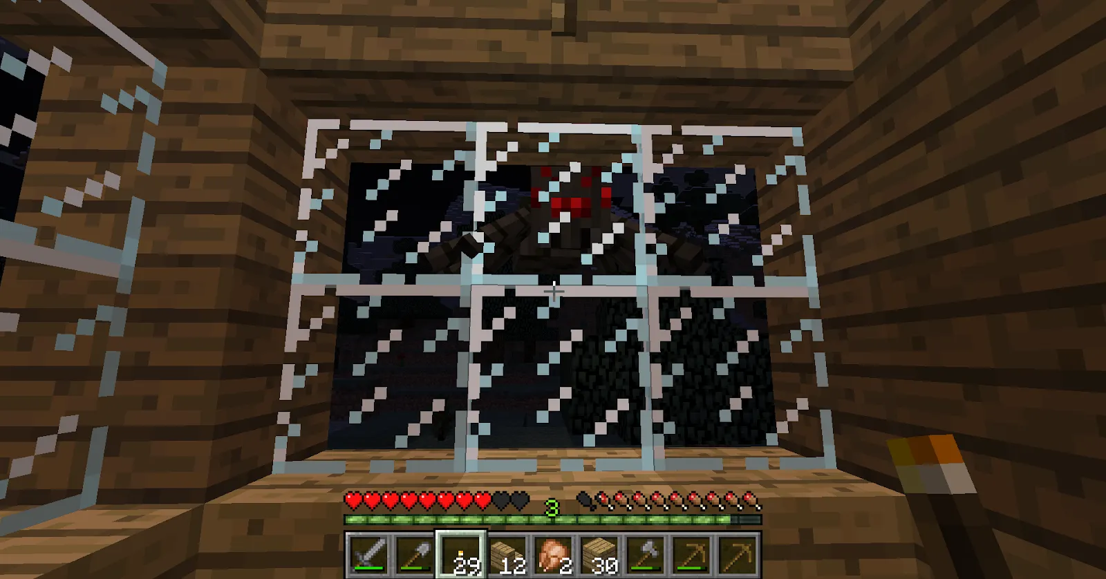 An image of a spider kept in a glass case in Minecraft