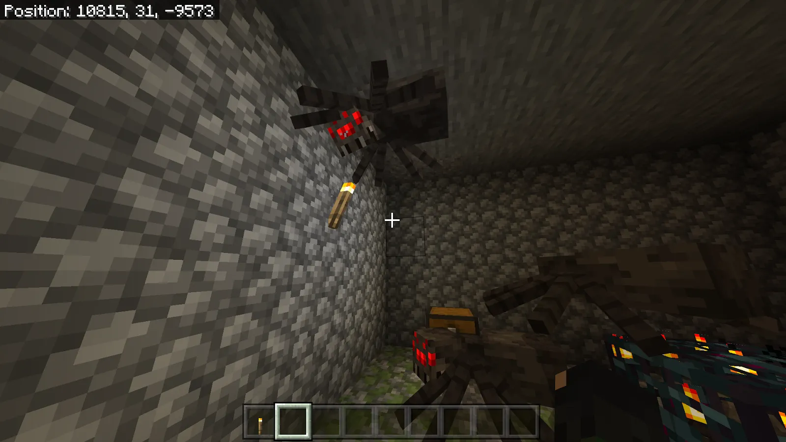 An image of a spider on the wall in Minecraft